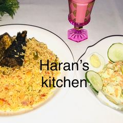 A picture of Jollof rice with coleslaw.