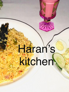 A picture of Jollof rice with coleslaw.