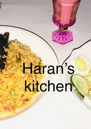 A picture of Jollof rice with coleslaw.