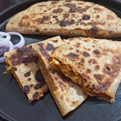 A picture of Leftover roti sandwich for breakfast.