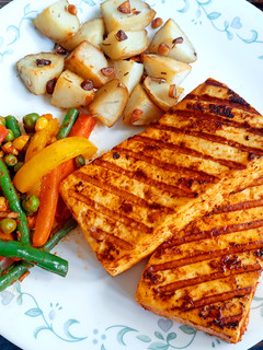 A picture of Peri-Peri Paneer Steaks with Tossed Vegetables.