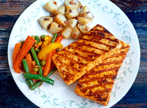 A picture of Peri-Peri Paneer Steaks with Tossed Vegetables.