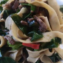 A picture of Fusion tagliatelle, steak mince, spring greens Asian style.