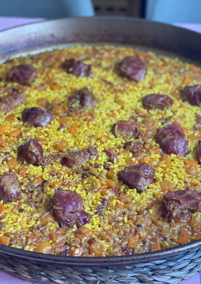 Una foto de Arroz de carrillera y calabaza
