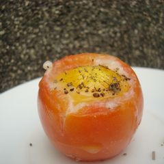 A picture of Baked Eggs in a tomato.