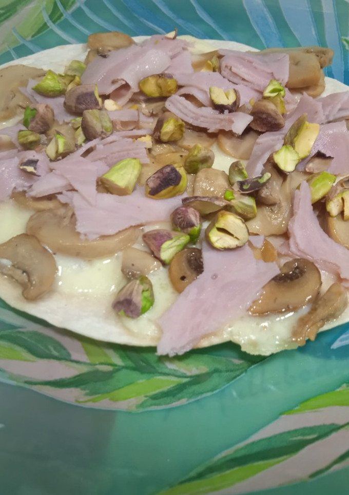Una foto de Tortipizza de champiñones, pistachos y queso
