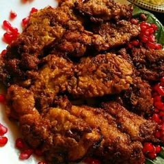 A picture of Grilled fish with pomegranate.