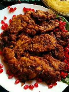 A picture of Grilled fish with pomegranate.