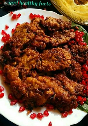 A picture of Grilled fish with pomegranate.