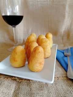 Una foto de Arancini sicilianas
