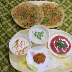 DELICIOUS AALOO PARATHA WITH RAAIYTA ACHAR KETCHUP & TEA A picture of DELICIOUS AALOO PARATHA WITH RAAIYTA ACHAR KETCHUP & TEA.