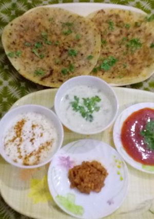 A picture of DELICIOUS AALOO PARATHA WITH RAAIYTA ACHAR KETCHUP & TEA.