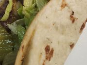 A picture of ground beef and flour tortilla