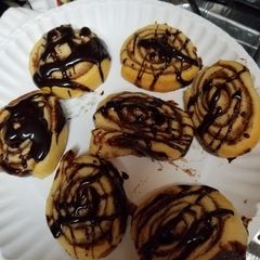 Cinnamon Sugar Cresent Pinwheels with chocolate drizzle A picture of Cinnamon Sugar Cresent Pinwheels with chocolate drizzle.