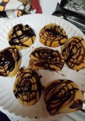 A picture of Cinnamon Sugar Cresent Pinwheels with chocolate drizzle.