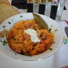 A picture of Pork stew with sauerkraut.