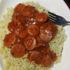 A picture of Noodles and fried smokie.