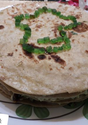 A picture of Veg cheese quesadillas with edible logo.