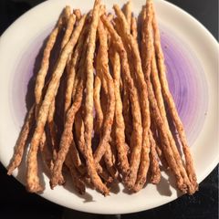 A picture of Turkey and cheese sticks for dogs.