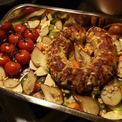 A picture of Swedish falukorv (sausage) in oven with roasted vegetable & pear.
