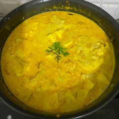 A picture of Thai yellow curry with paneer and cauliflower.