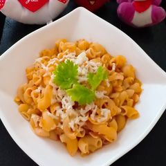 A picture of Cheesy red sauce pasta.