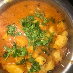 A picture of Aloo ki sabzi-tomato gravy ke sath.