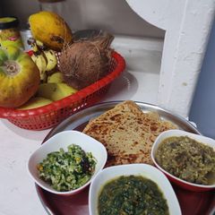 A picture of #HBC# Jowar Panner paratha,saag,snake gaurd,banana steam subji.