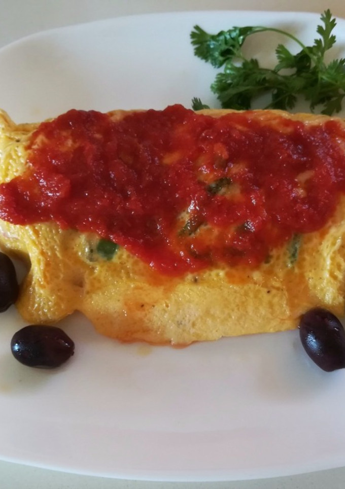 Una foto de Tortilla de pimientos y quesos
