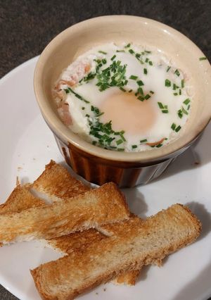 A picture of Microwave Egg Cocotte with Bacon and Chives.
