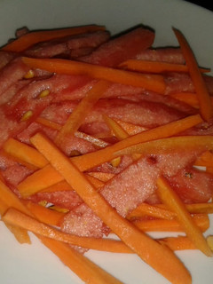 A picture of Water melon and carrot salad.
