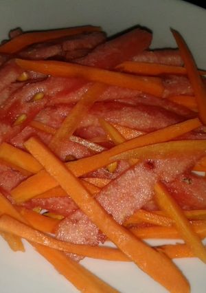 A picture of Water melon and carrot salad.