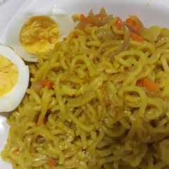 Curry noddles with carrots and boiled egg A picture of Curry noddles with carrots and boiled egg.