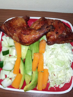 A picture of Chicken with salad.
