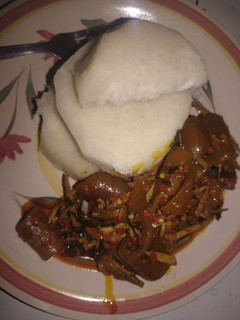 A picture of Boiled yam and ugba sauce.