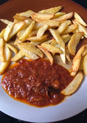 A picture of Irish potatoes and tomatoes sauce.