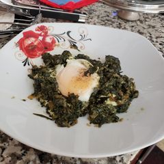 A picture of Spinach 🍀 with egg 🥚.