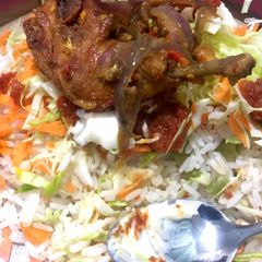 Rice and stew with pepper chicken A picture of Rice and stew with pepper chicken.