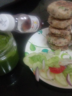 A picture of Rajma beans and potato cuttalet with green garlic chatny and salad.