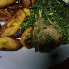 Plantain with Vegetable sauce and goat meat A picture of Plantain with Vegetable sauce and goat meat.