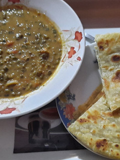 A picture of Ndengu in coconut sauce served with chapati.