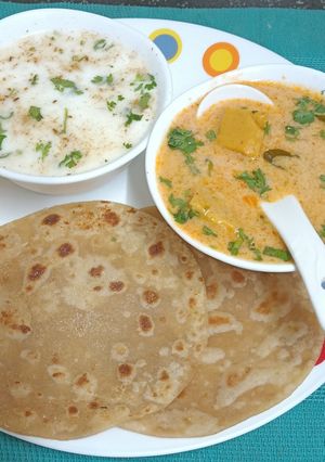 A picture of Heirloom Traditional Thali ---- Dhokli Nu Shake, Jaggery, Bhakri, & Chaas.