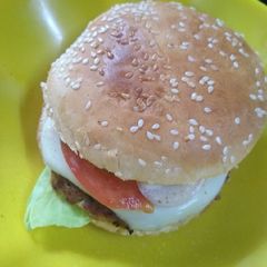 A picture of Healthy cheesy burger with soya pattice.