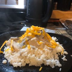 A picture of Chicken and Rice with Mushroom Sauce.