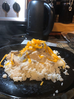 A picture of Chicken and Rice with Mushroom Sauce.