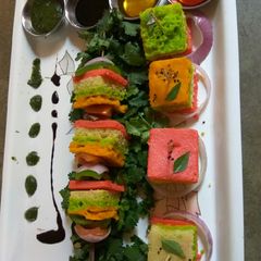 A picture of Colourful rava Dhokla.