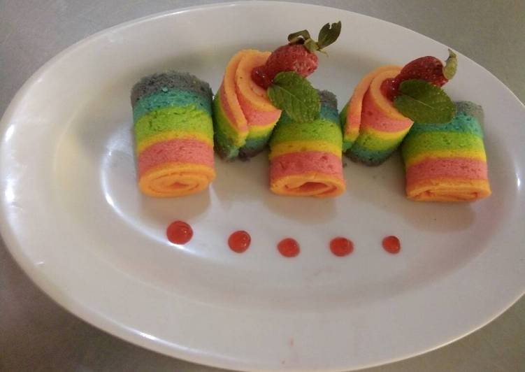 Rainbow Roll Cake Delight with Strawberry Sauce