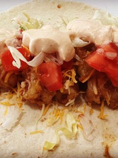 A picture of Shrimp Tacos with Homemade Shrimp Taco Sauce.