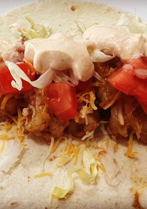 A picture of Shrimp Tacos with Homemade Shrimp Taco Sauce.
