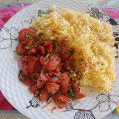 A picture of Carrot rice with mini bite stew.